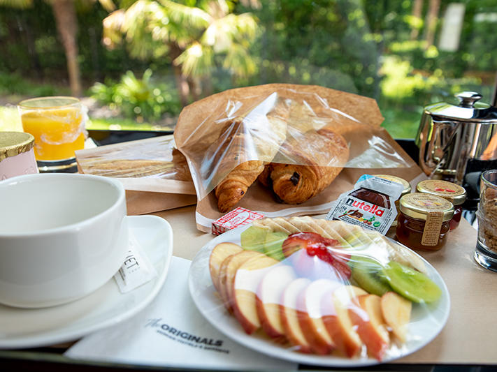 Breakfast meal with fruits & drinks at The Originals Hotels