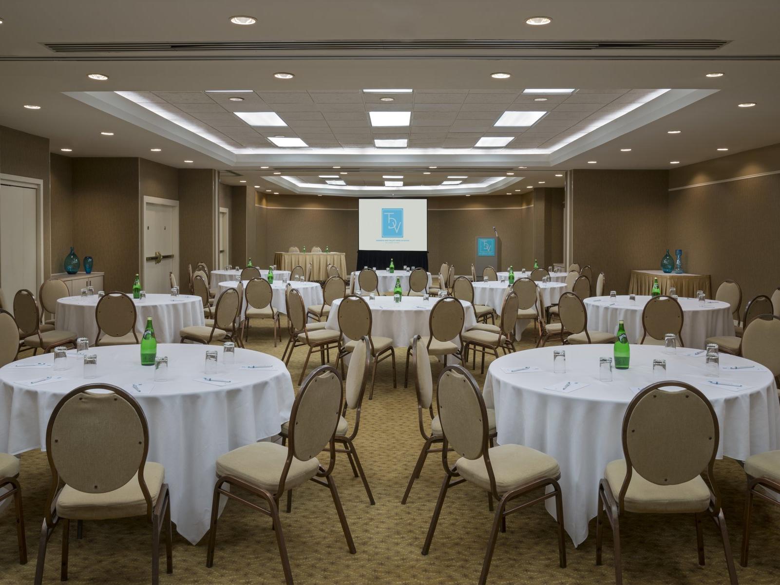 large meeting room with tables and chairs