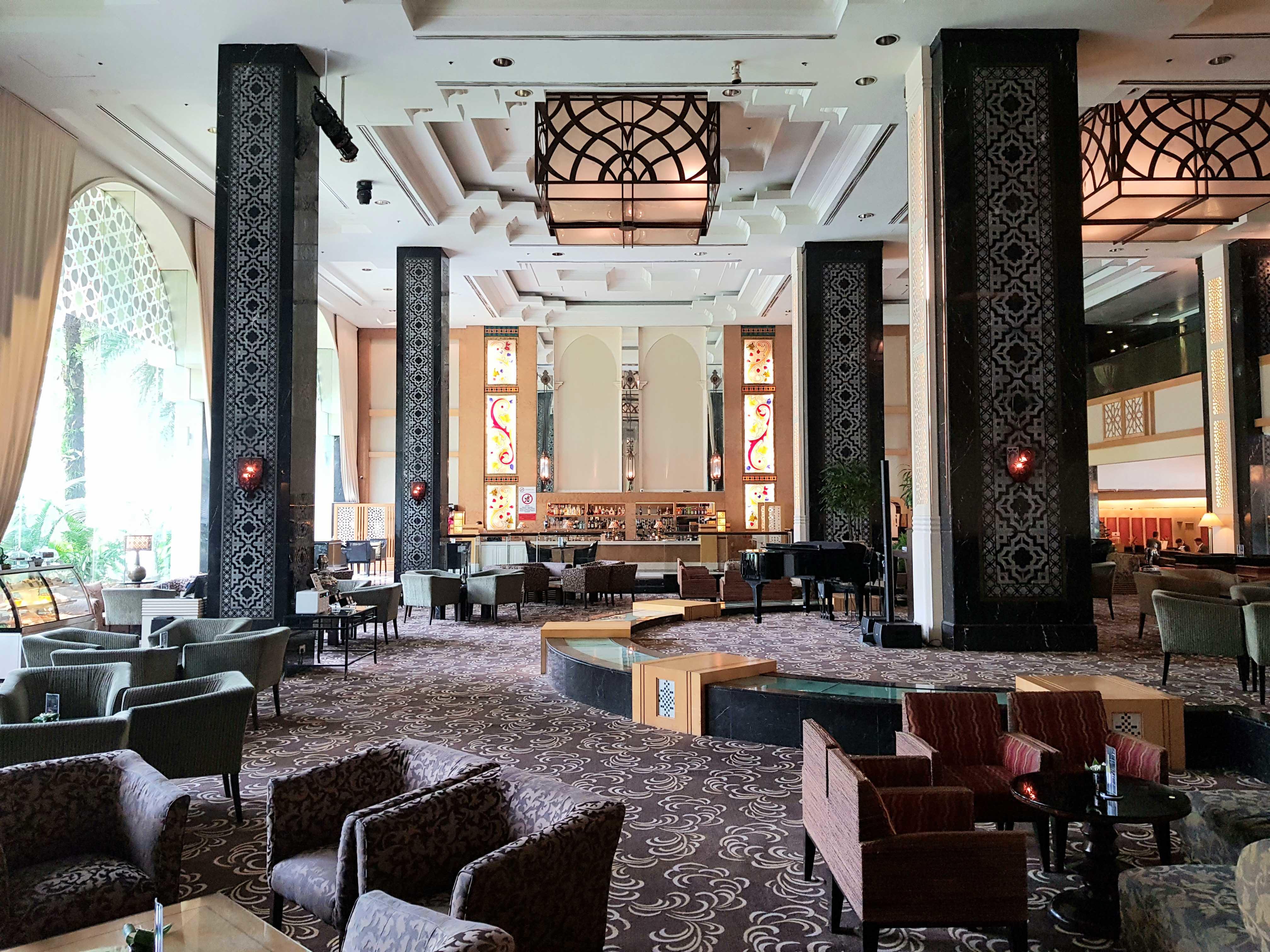 Interior of Songket Lounge, furnished with couches and coffee tables