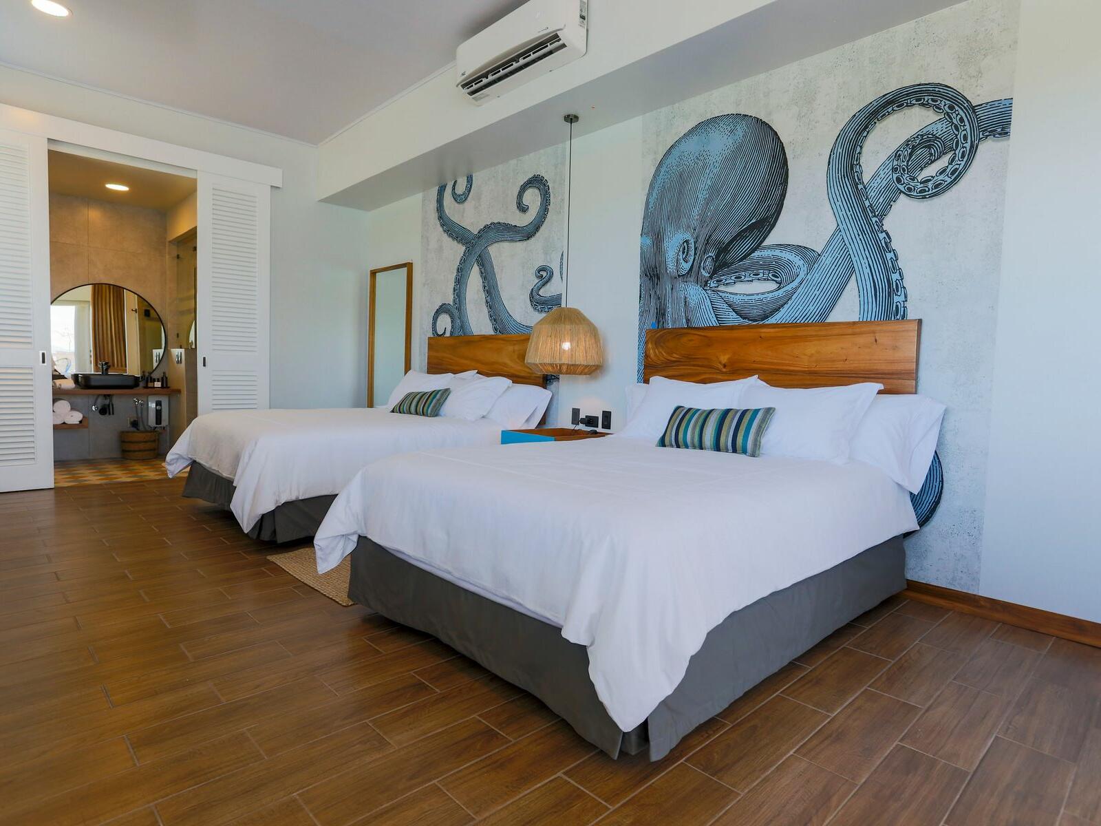 Two double beds in Standard Double Room at Marina Bahia Golfito