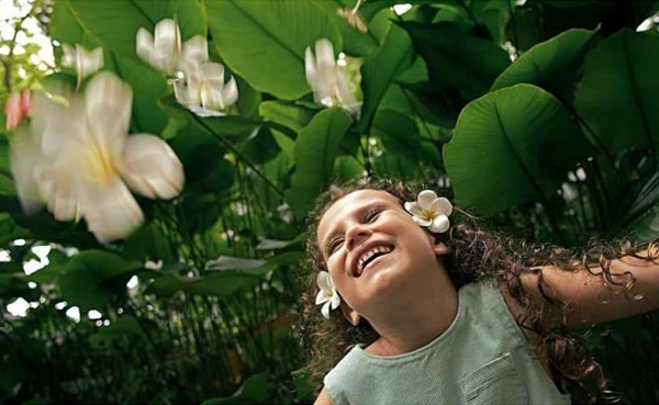 A girl enjoying nature at Singapore Botanic Gardens near The Fullerton Hotel Singapore