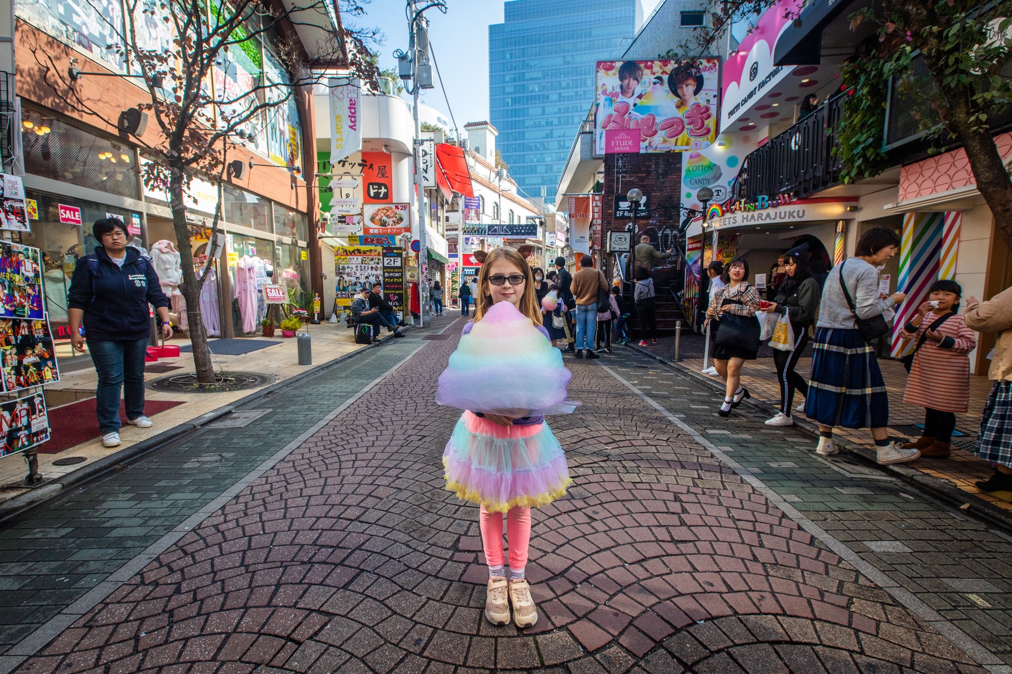 Girl posing with cotton candy on a street of Tokyo near Fullerton Group