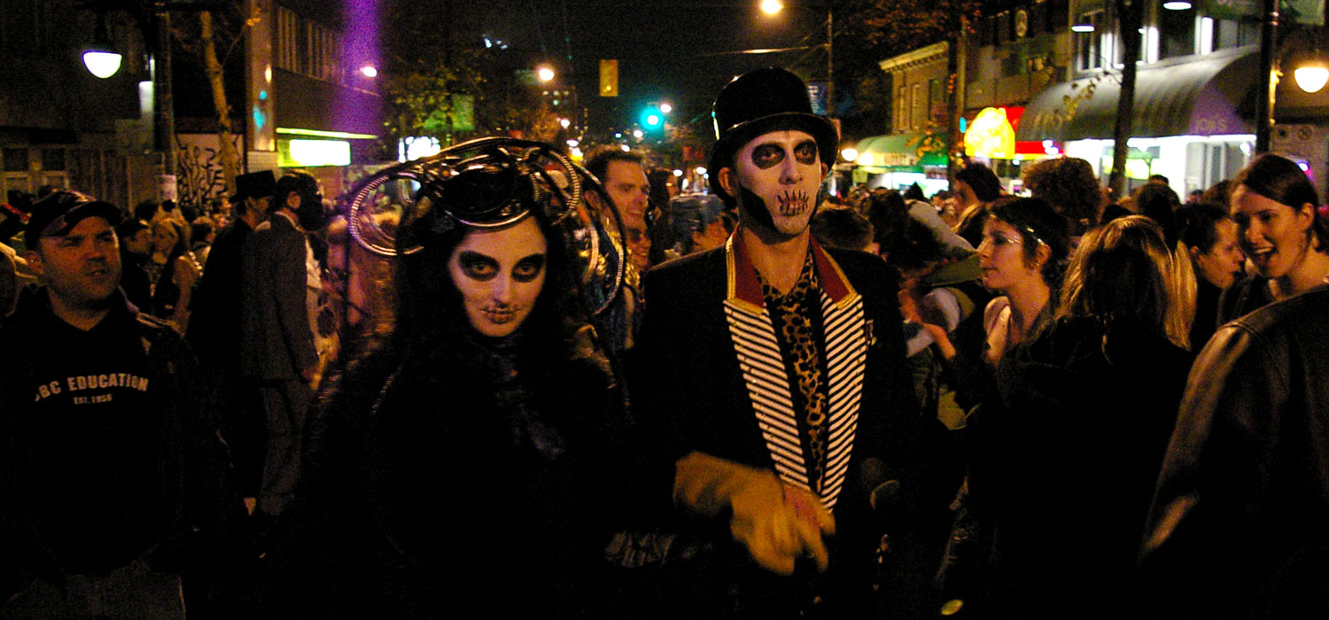 woman and man at the parade of lost souls dressed as skeletons