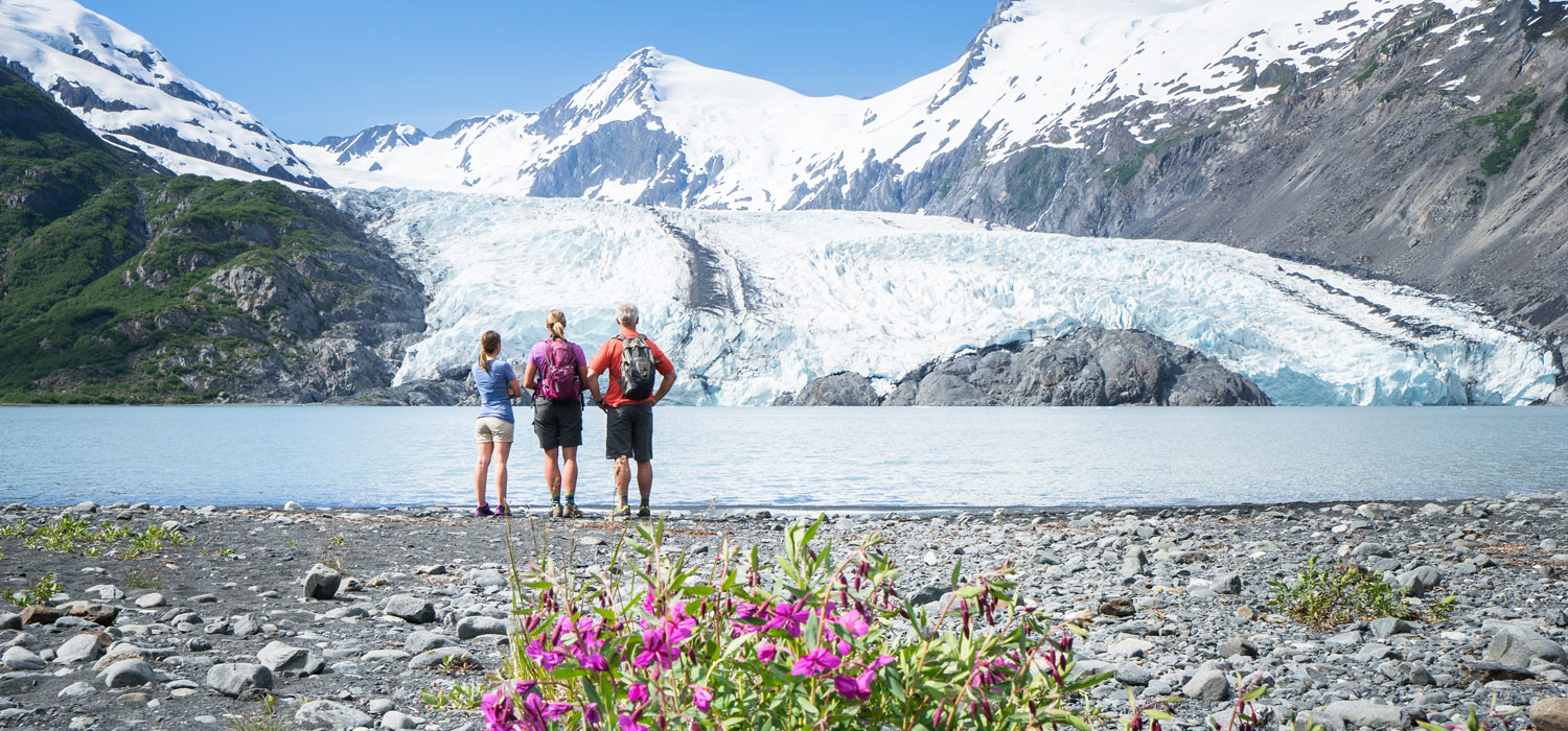 group standing in front of glacier during summer