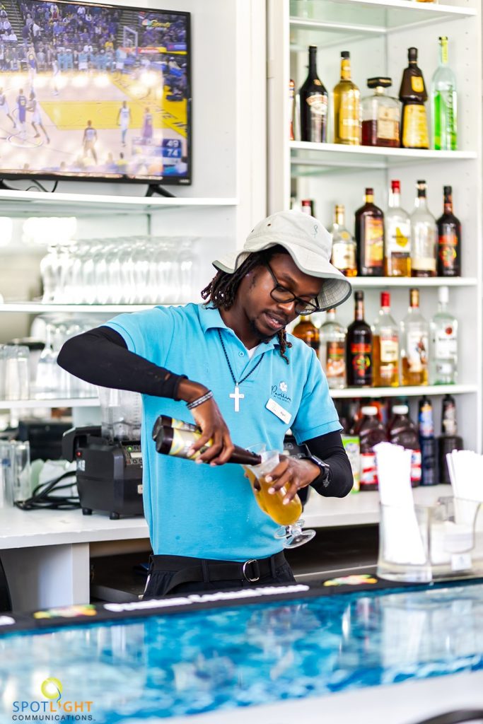 Bartender pouring beer in LunaSea’s, The Somerset on Grace Bay