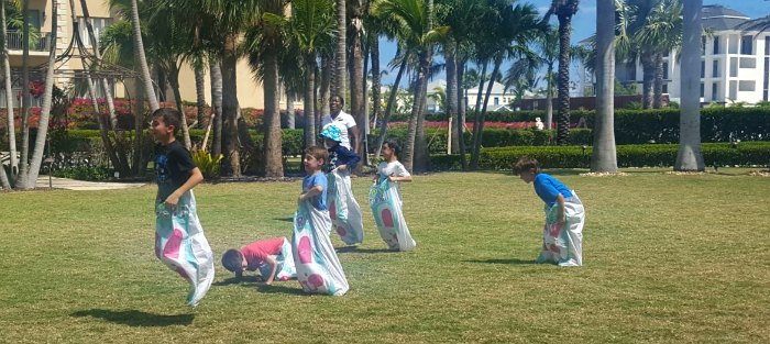 Kids playing in the garden at The Somerset on Grace Bay