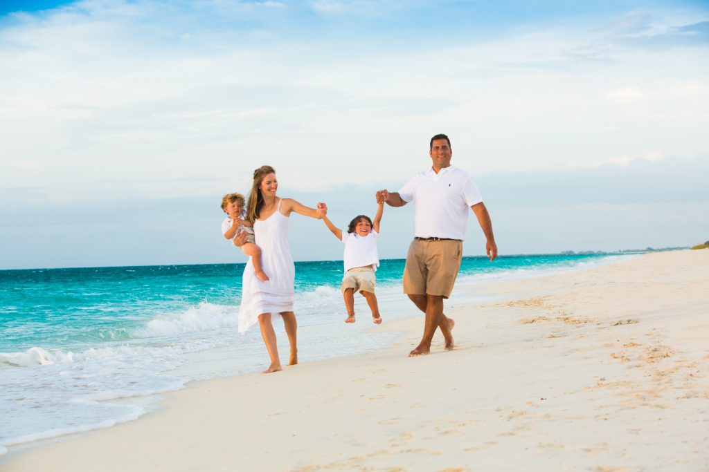 Family enjoying by the sea at The Somerset on Grace Bay