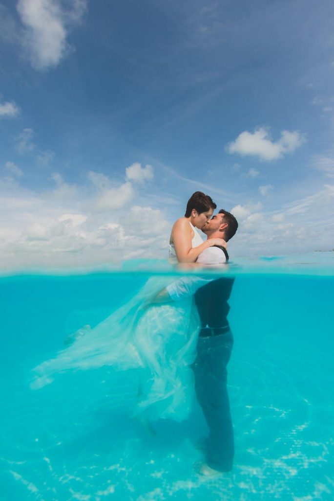 Couple kissing in the pool at The Somerset on Grace Bay