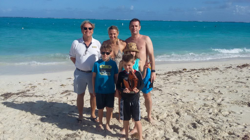 Family posing, picture on the beach, The Somerset On Grace Bay
