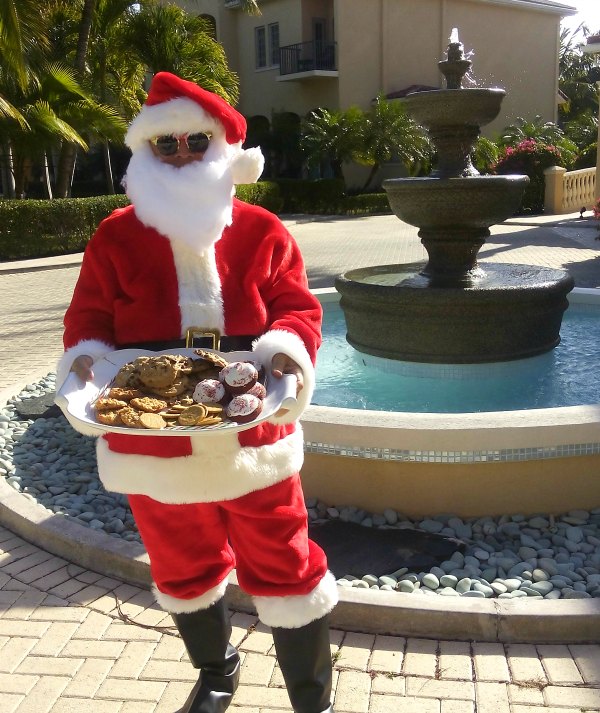 Santa posing, picture with cookies at The Somerset On Grace Bay