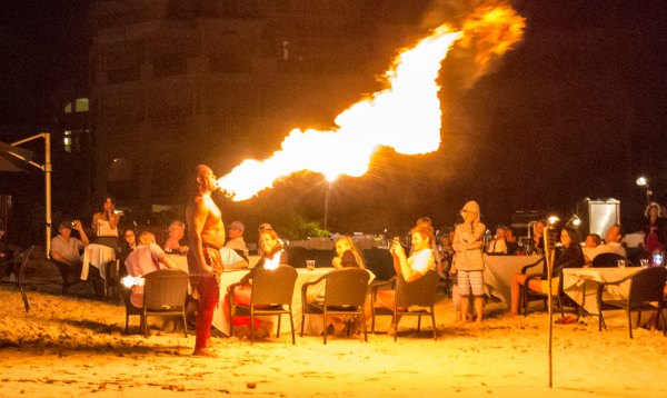 Fire eater performing at The Somerset On Grace Bay