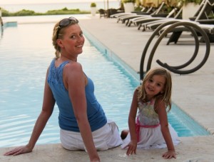 Mother & daughter enjoying in a pool, The Somerset On Grace Bay
