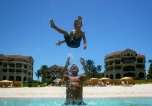 Dad & son enjoying on the beach at The Somerset On Grace Bay