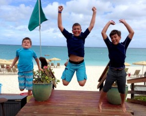 Kids enjoying on the beach at The Somerset On Grace Bay