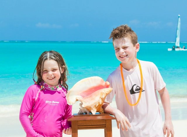 Kids posing for a picture near The Somerset On Grace Bay