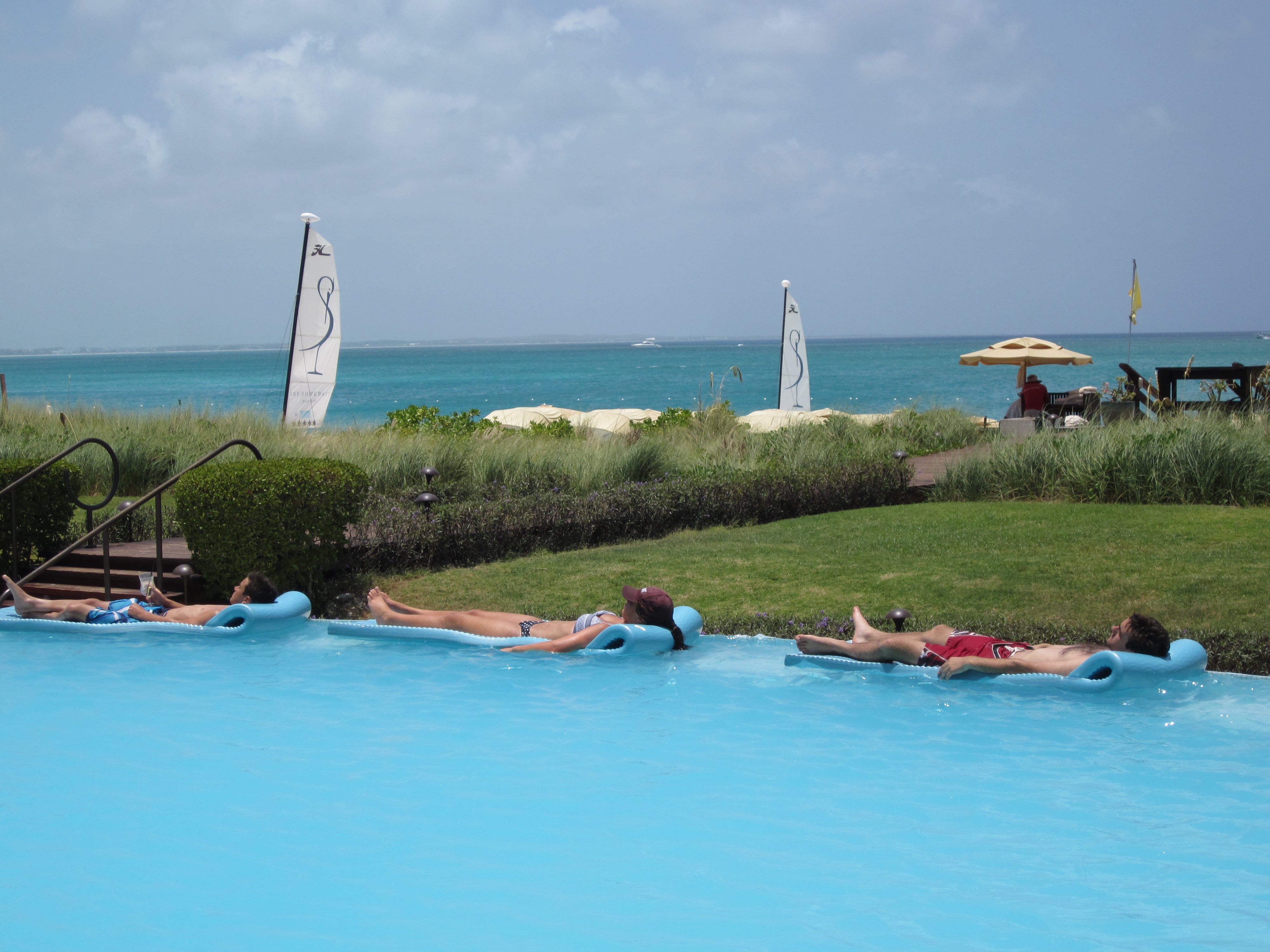 Tourists sunbathing at The Somerset On Grace Bay