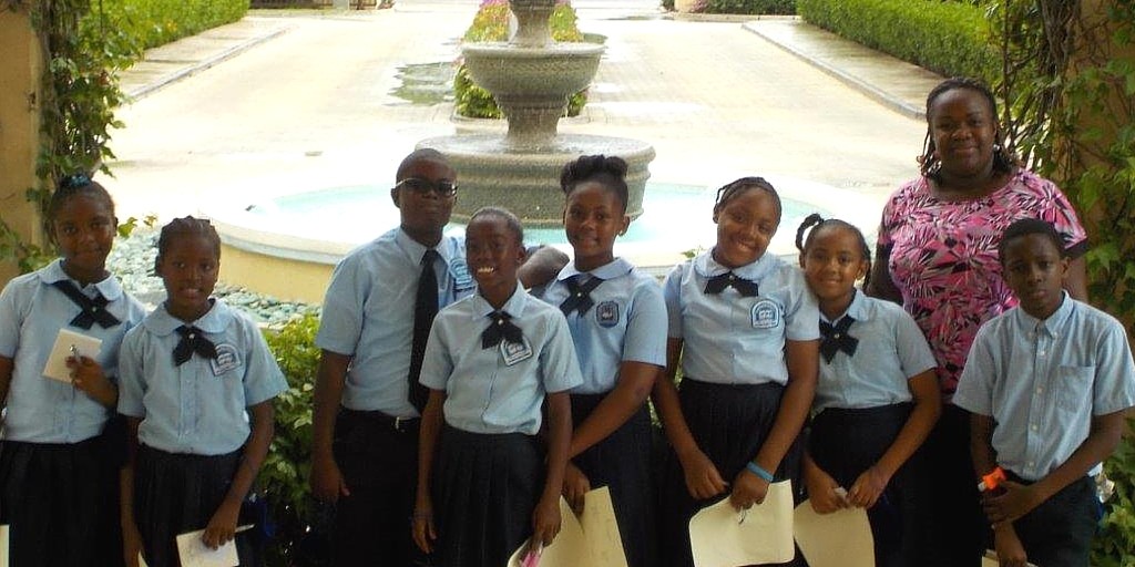 A group of students posing at The Somerset on Grace Bay