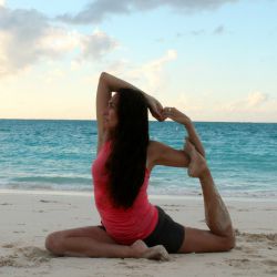 Lady engaged in Yoga at The Somerset on Grace Bay