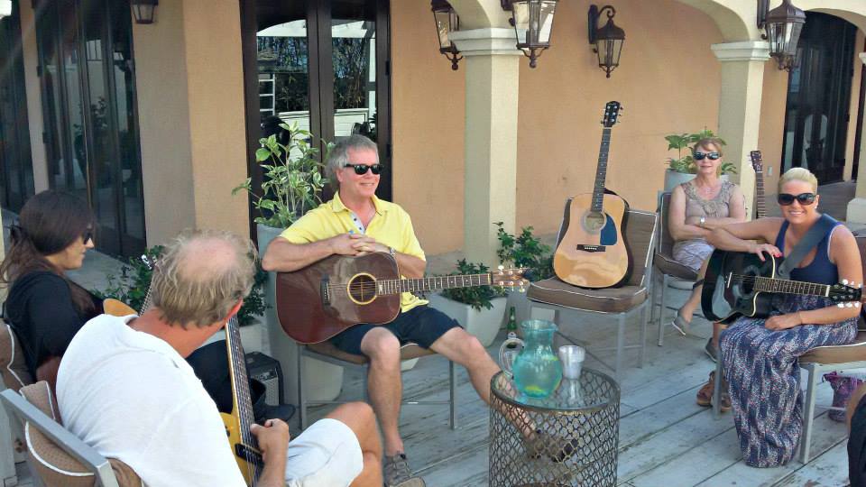 People playing guitars at The Somerset on Grace Bay