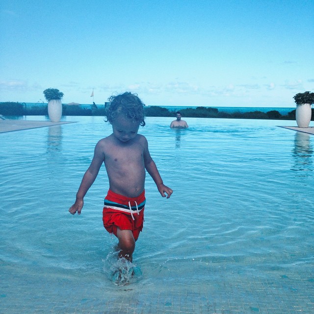A child walking on a pool at The Somerset on Grace Bay