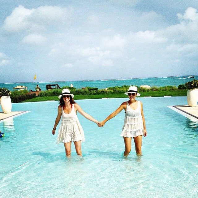 Two girls posing a picture in a pool, The Somerset on Grace Bay