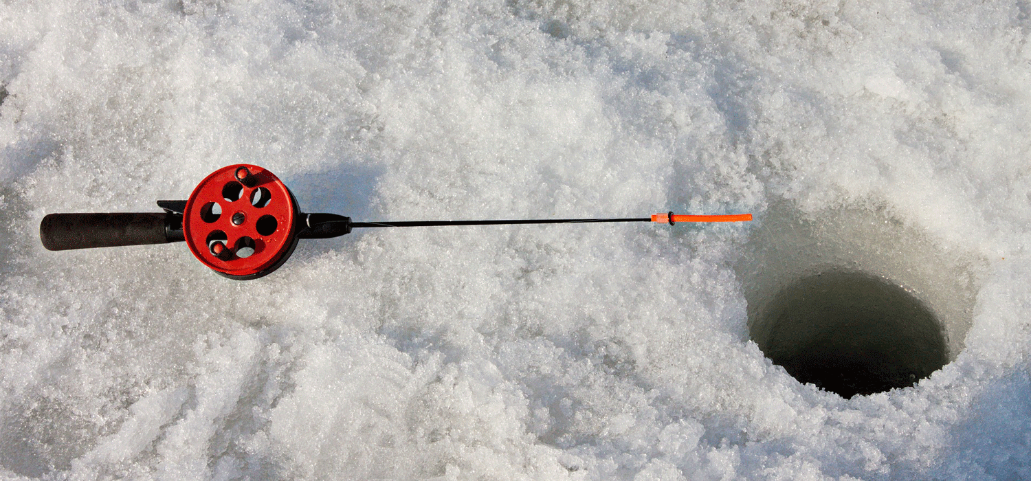 small fishing pole next to a hole in the ice